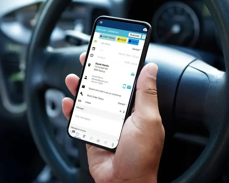 man holding mobile phone looking at the service dynamics application