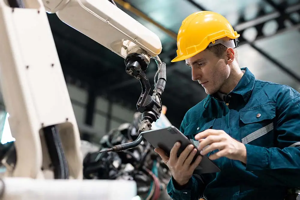 plant worker looking at tablet