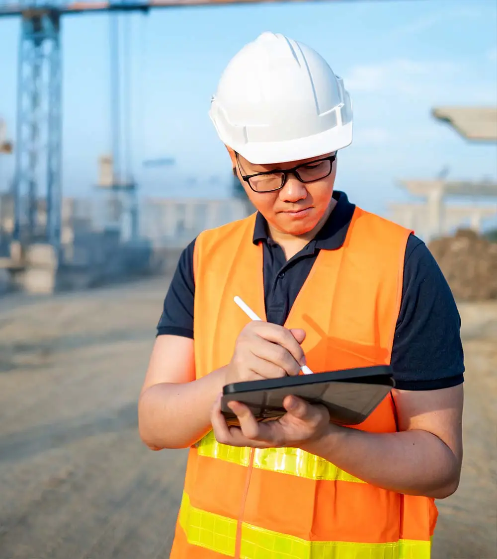 inspector taking notes on tablet