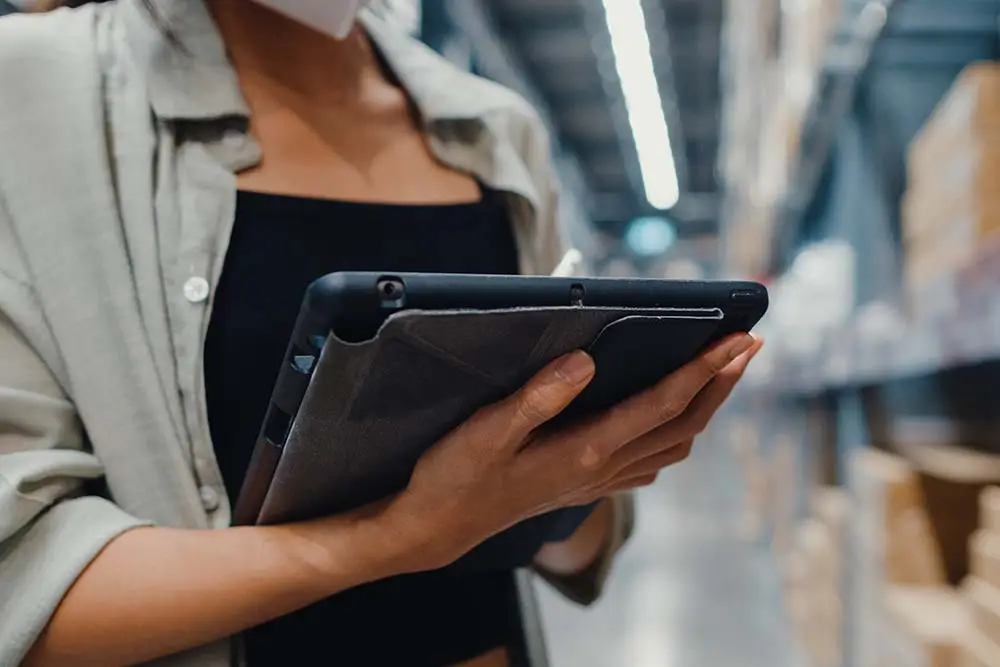woman on tablet in warehouse
