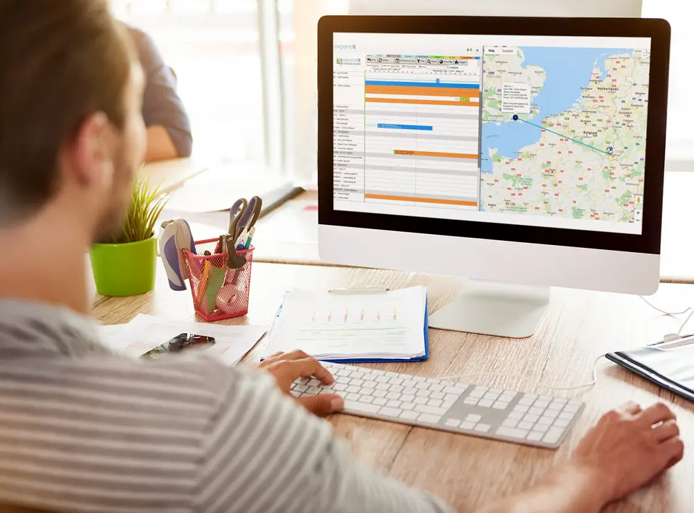 man working on scheduling software